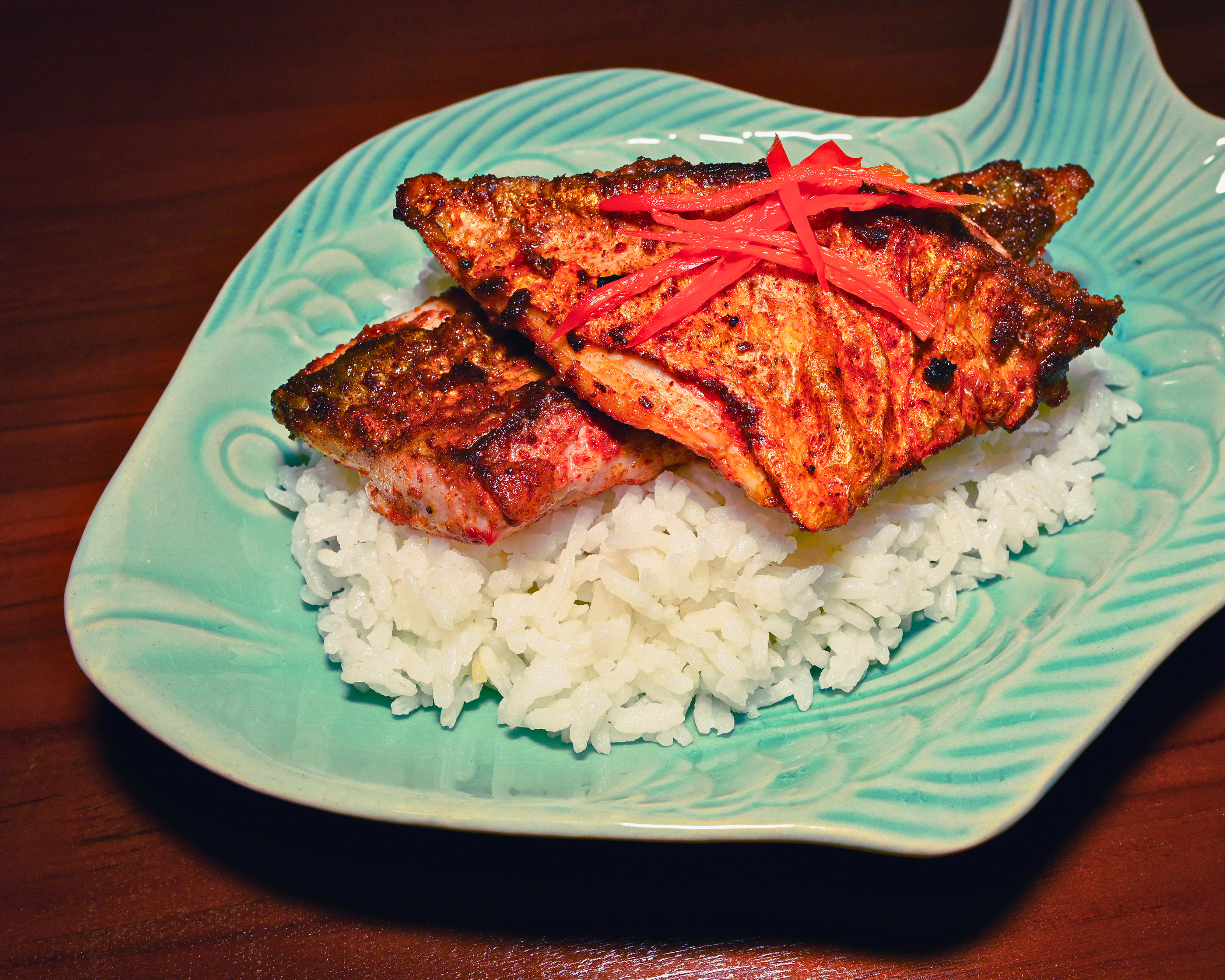 Black & Green (Asian Blacked Fish on Seared Rice) served with XO sauce by Flavours - $14